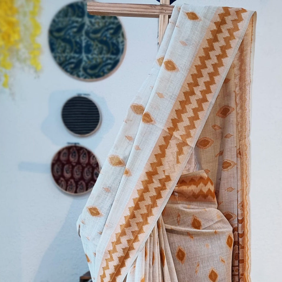 White Jamdani Saree with Geometric Mustard Weaving Closeup of Weaving