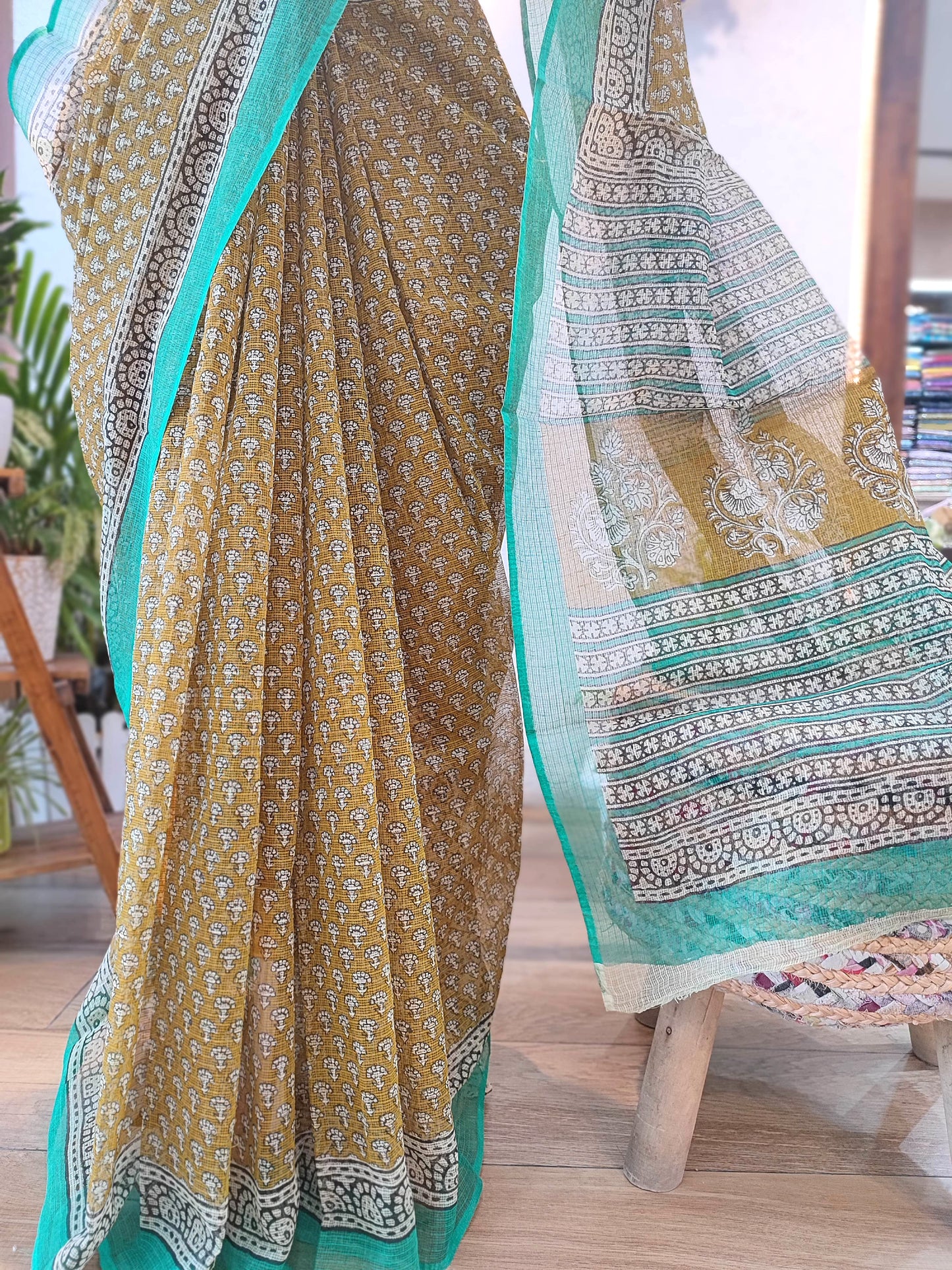 Handblock Printed Kota Doria Saree – Mustard with Green Border & Floral Motifs