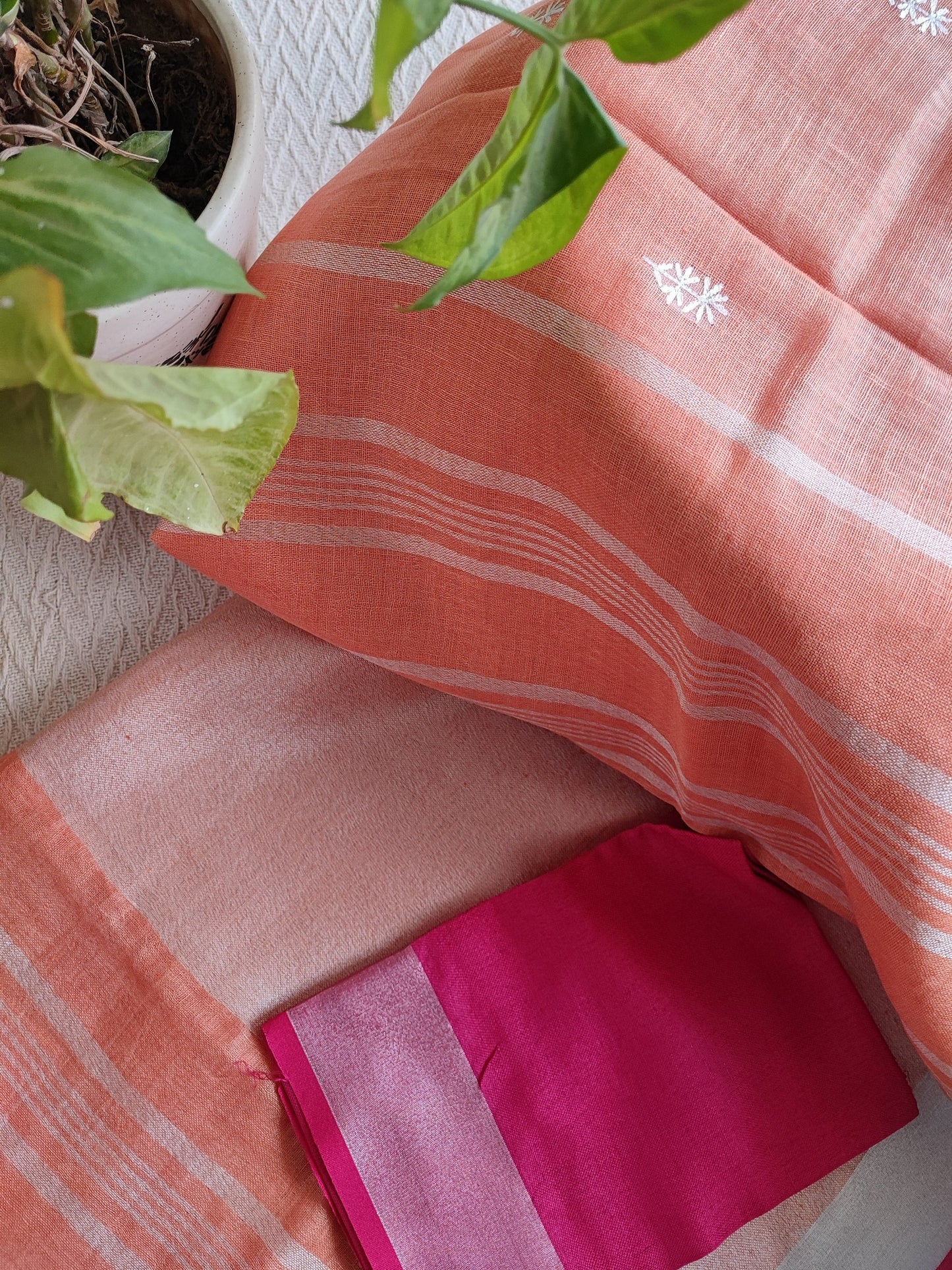 Peach Pure Linen Embroidered Saree with Tassels Detailing and Hot Pink Blouse