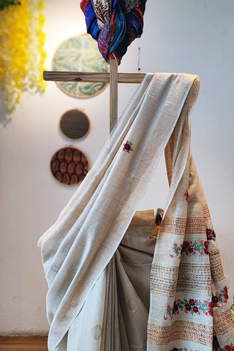 Cream Linen Silk Saree With Hand Embroidery and Floral Pallu