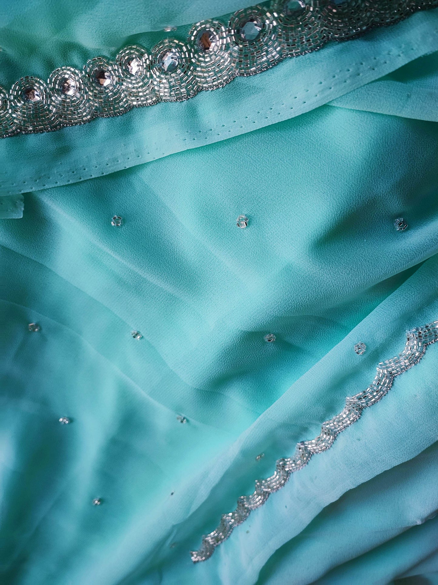 Firozi Semi Georgette Saree With Handwork Border & Blouse