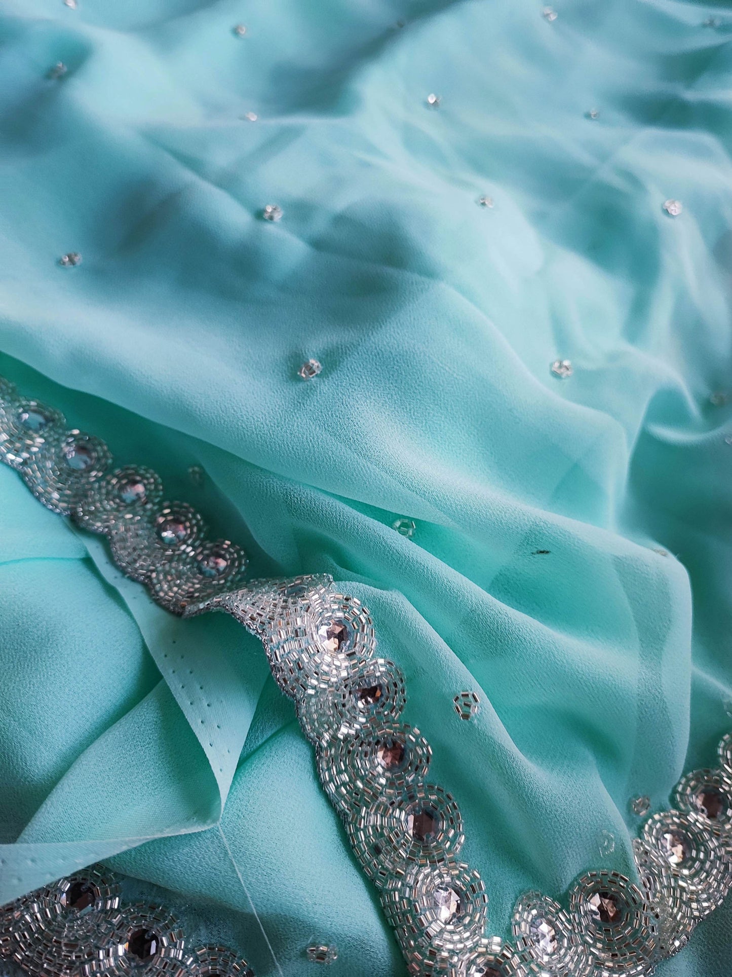 Firozi Semi Georgette Saree With Handwork Border & Blouse