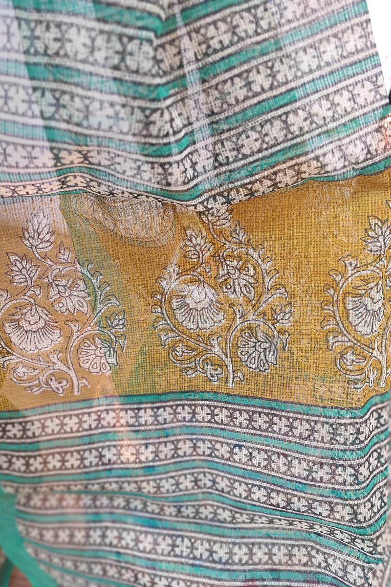 Handblock Printed Kota Doria Saree – Mustard with Green Border & Floral Motifs