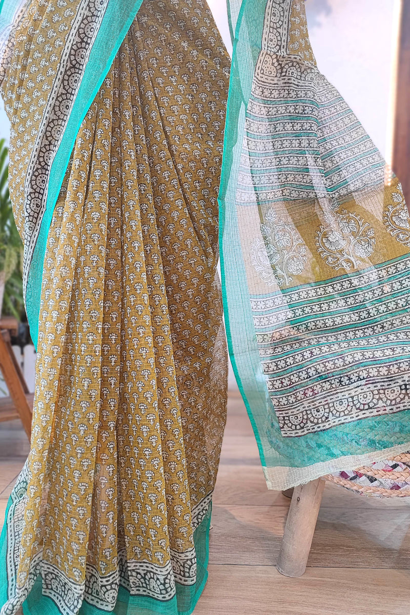 Handblock Printed Kota Doria Saree – Mustard with Green Border & Floral Motifs