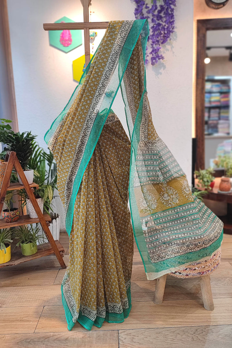 Handblock Printed Kota Doria Saree – Mustard with Green Border & Floral Motifs