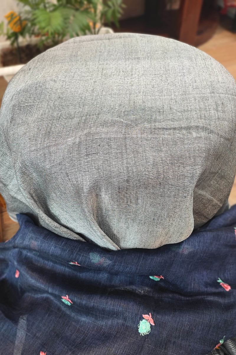 Navy Blue Pure Linen Saree with Multicolor Floral Embroidery, Silver Border & Checkered Pallu – Everyday Elegance with White-Black Tassels