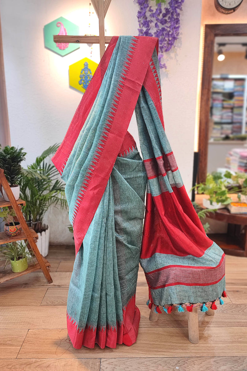 Vibrant Turquoise Green and Red Pure Linen Saree with Woven Border and Multicolor Tassel Pallu – Lightweight Ethnic Drape for Office & Festive Wear