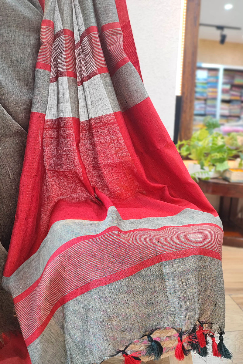 Elegant Grey and Red Pure Linen Saree with Woven Border and Multi-Color Tassel Pallu – Lightweight Traditional Drape for Festive & Office Wear