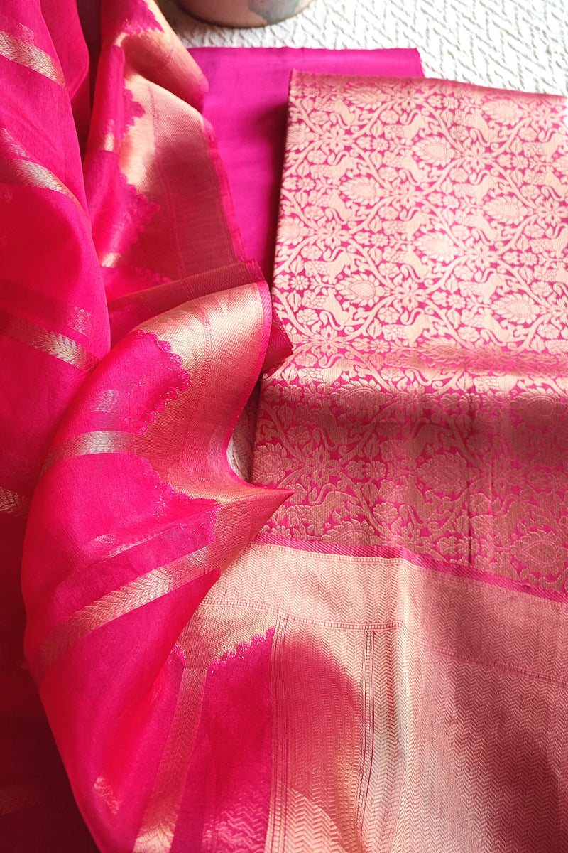Zari striped dupatta in bright pink Banarasi suit set
