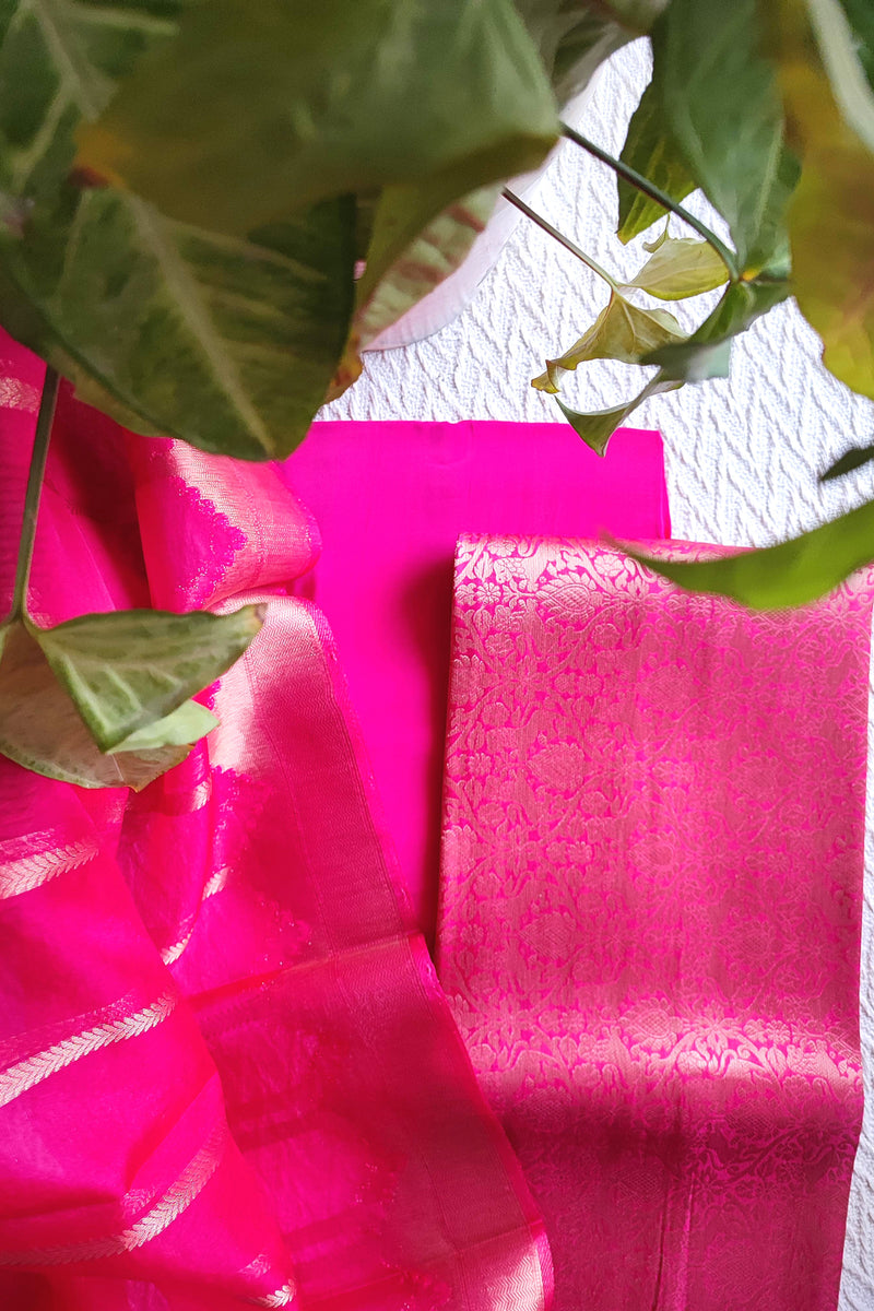 Zari striped dupatta in bright pink Banarasi suit set