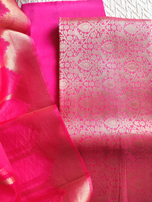 Zari striped dupatta in bright pink Banarasi suit set