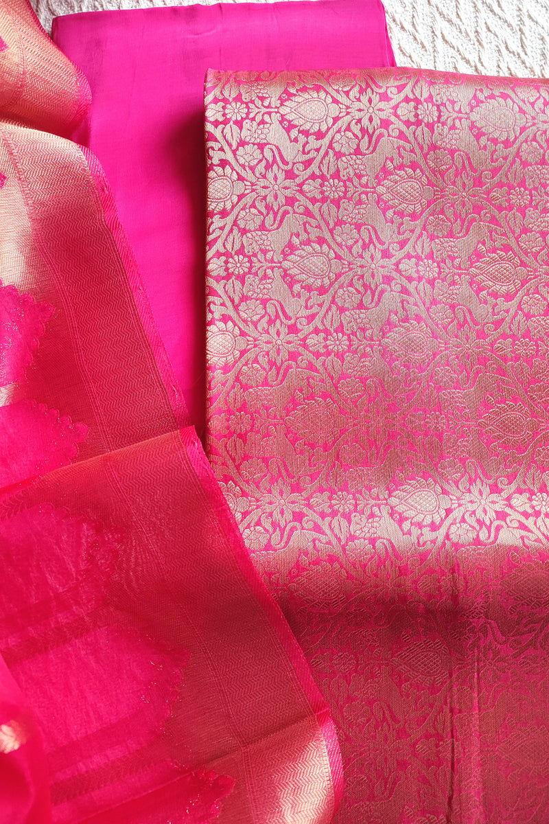 Zari striped dupatta in bright pink Banarasi suit set