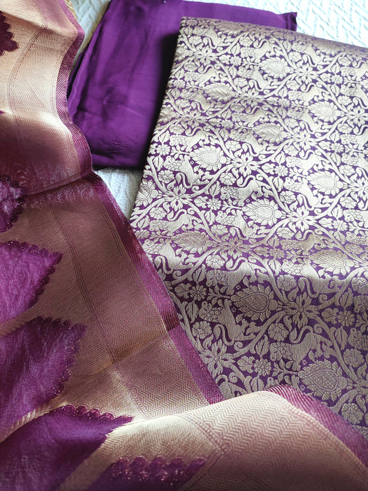 Brocade top fabric in plum with floral zari weaving