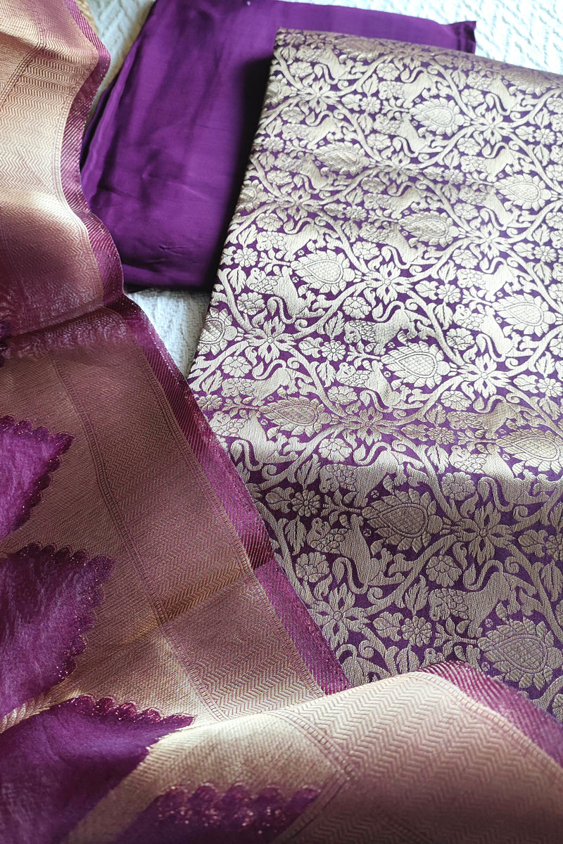 Brocade top fabric in plum with floral zari weaving