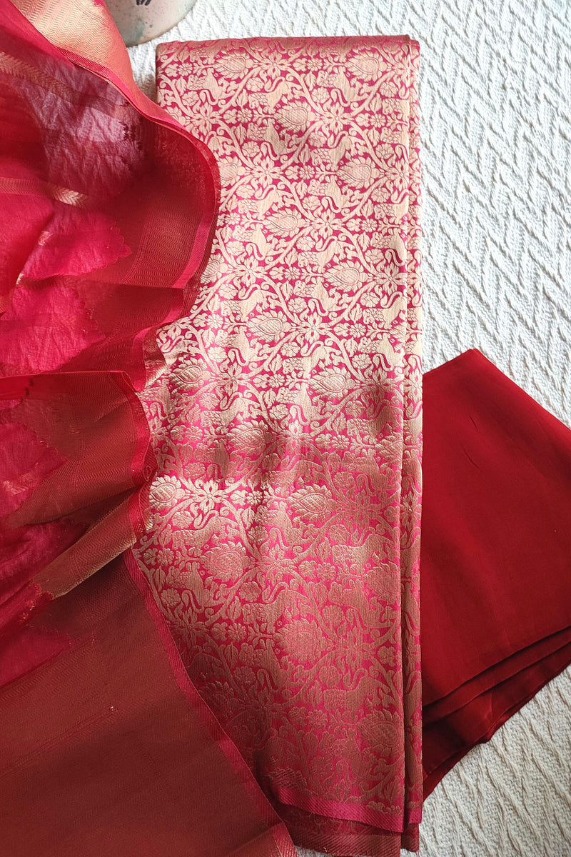 Rani pink Banarasi georgette suit with gold zari weaving