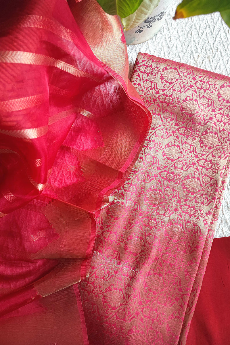 Rani pink Banarasi georgette suit with gold zari weaving