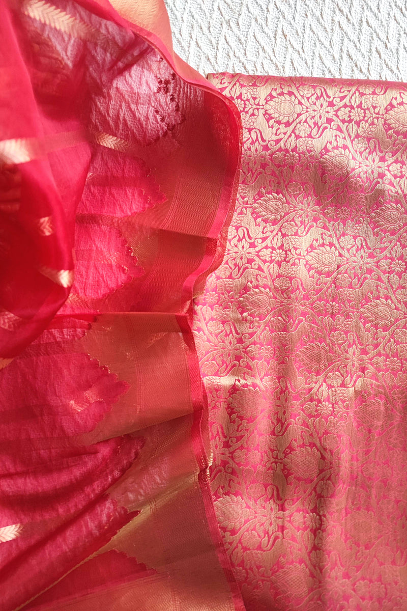 Rani pink Banarasi georgette suit with gold zari weaving