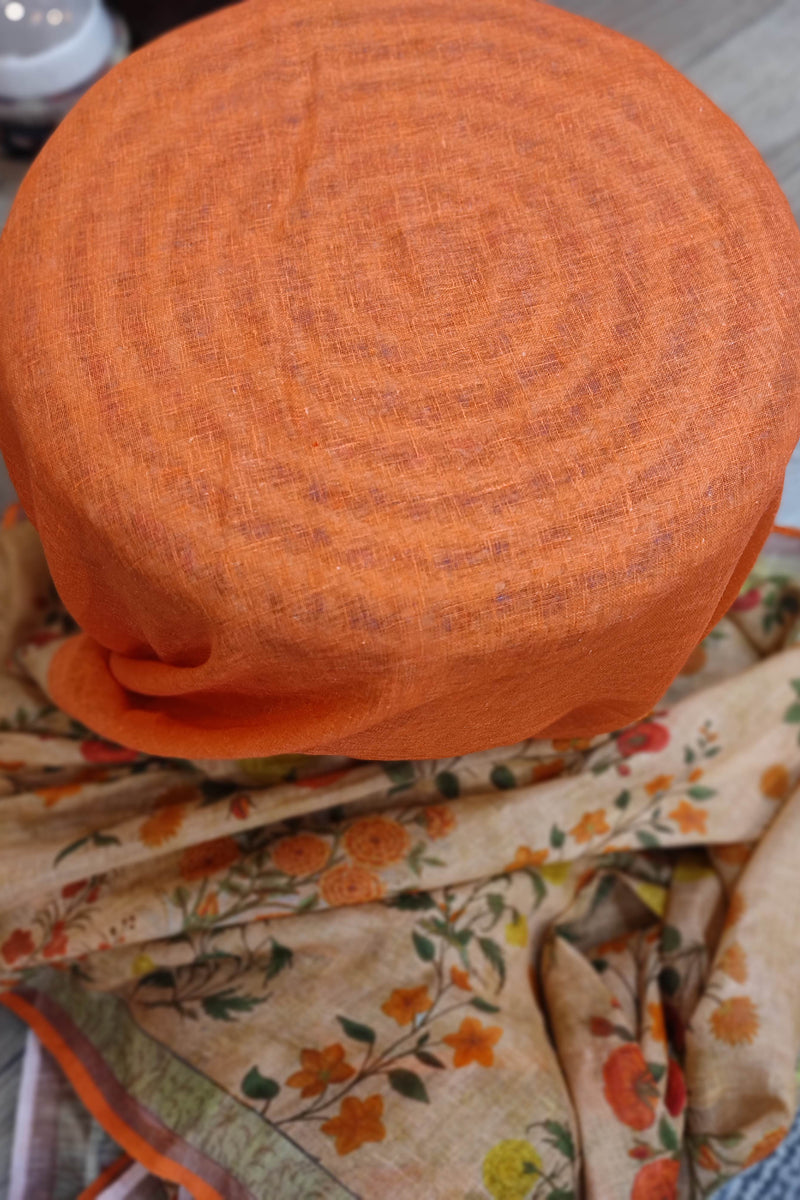 Beige Floral Printed Linen Cotton Saree with Orange Border & Multicolor Tassels