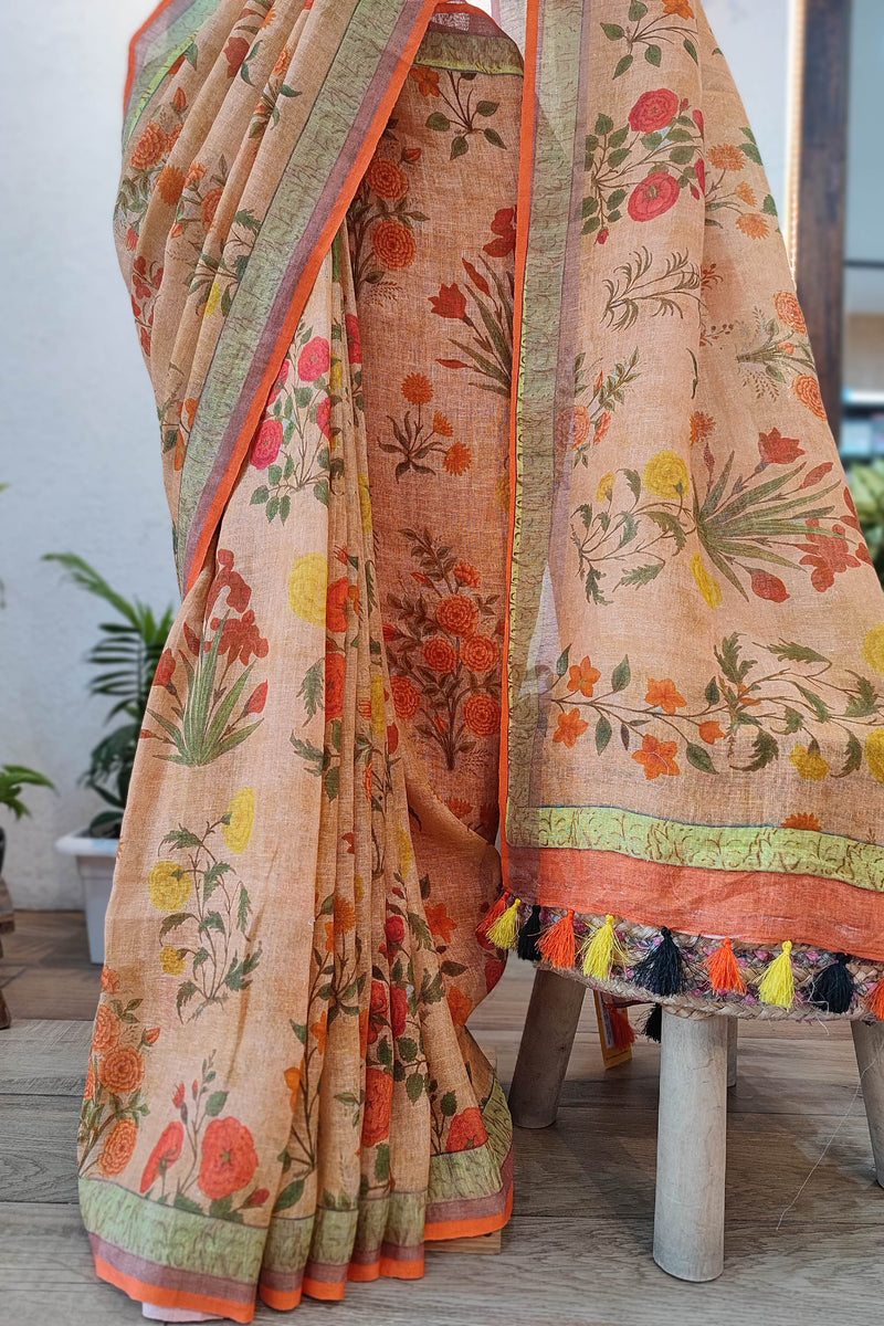 Beige Floral Printed Linen Cotton Saree with Orange Border & Multicolor Tassels