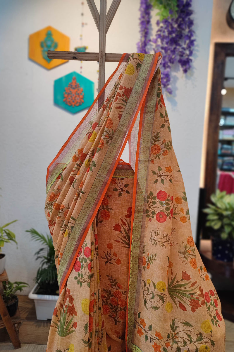 Beige Floral Printed Linen Cotton Saree with Orange Border & Multicolor Tassels
