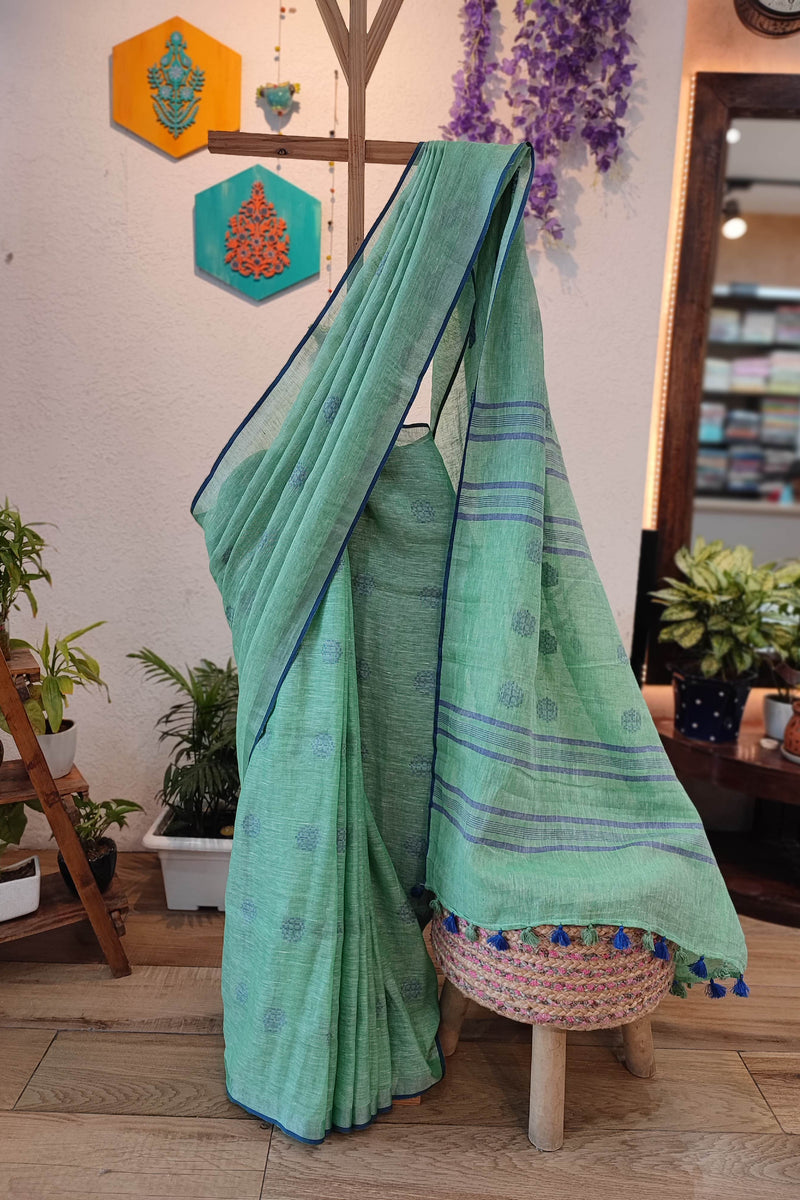 Sea Green Linen Cotton Saree with Woven Buti, Contrast Blue Border & Tassels