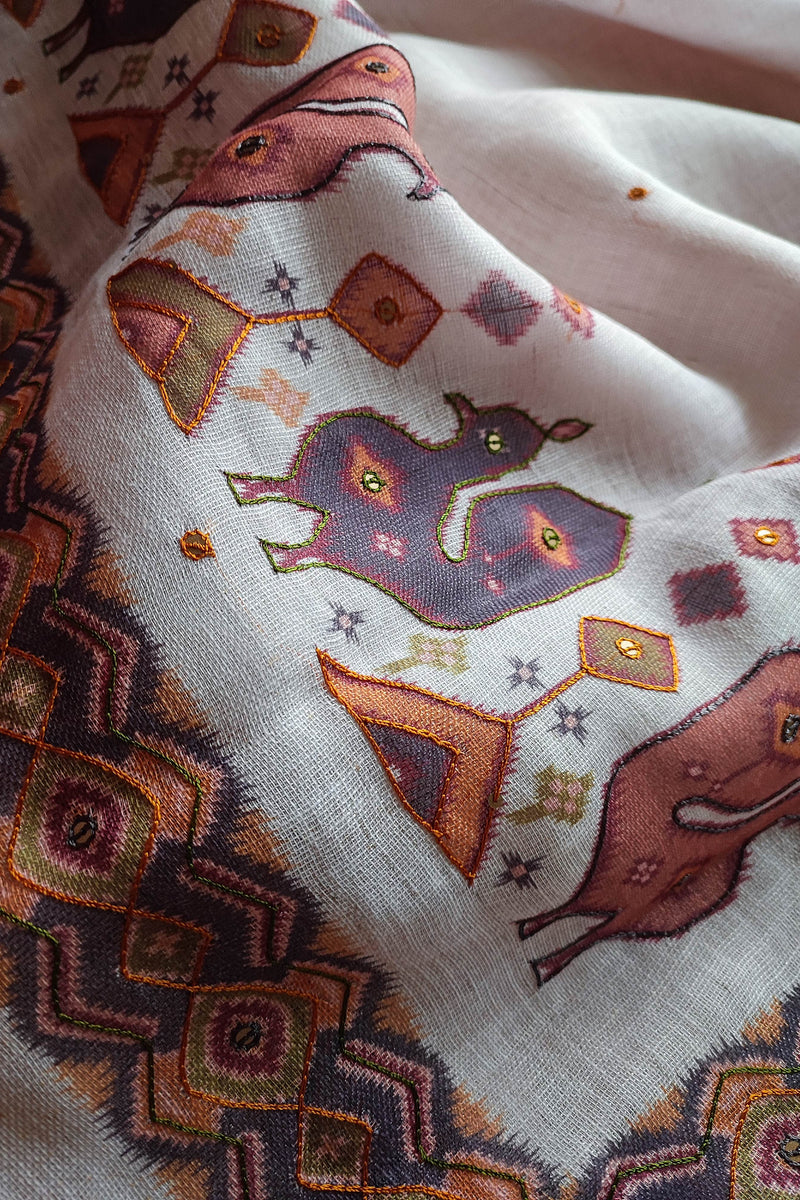 White Linen by Cotton Saree with Folk Print & Embellished Details