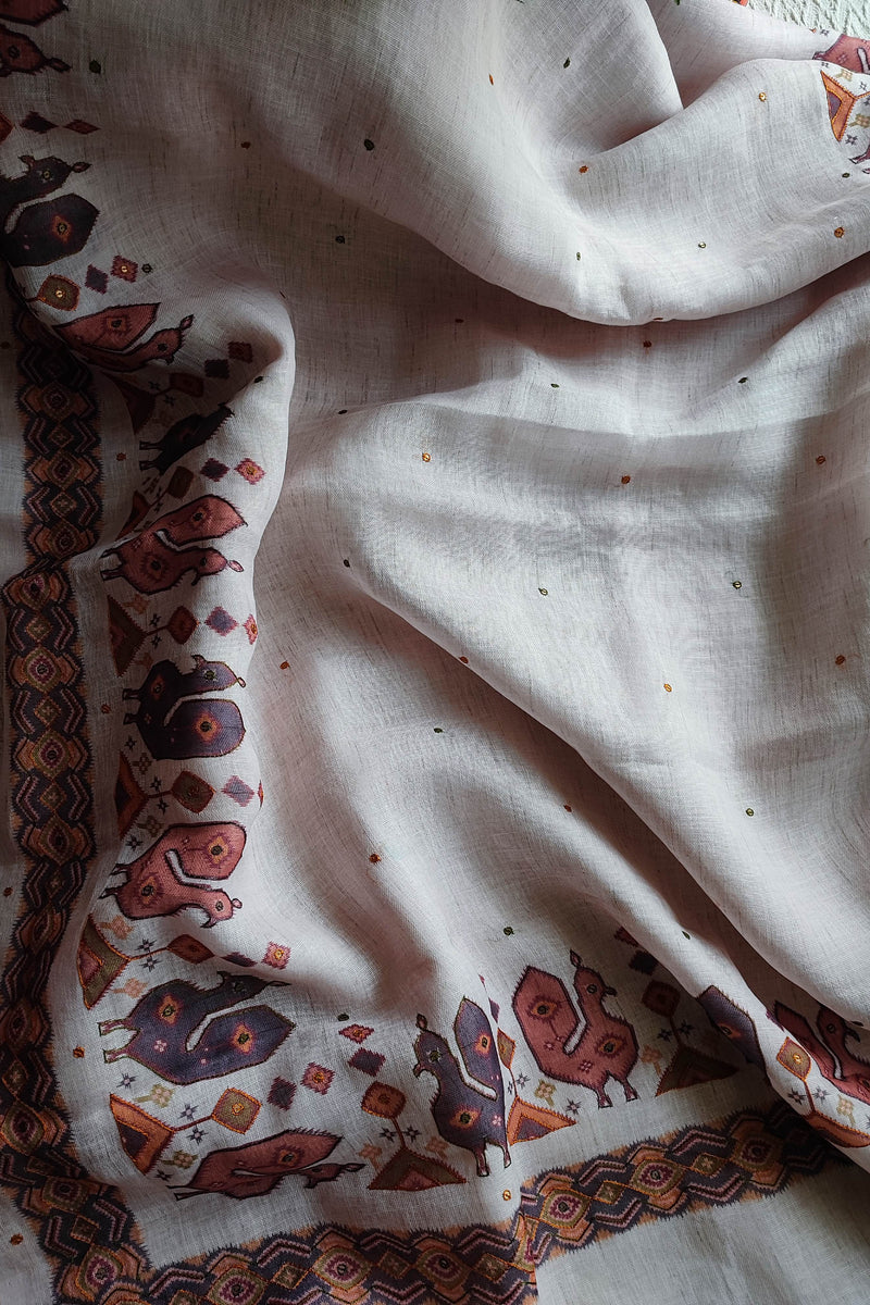 White Linen by Cotton Saree with Folk Print & Embellished Details
