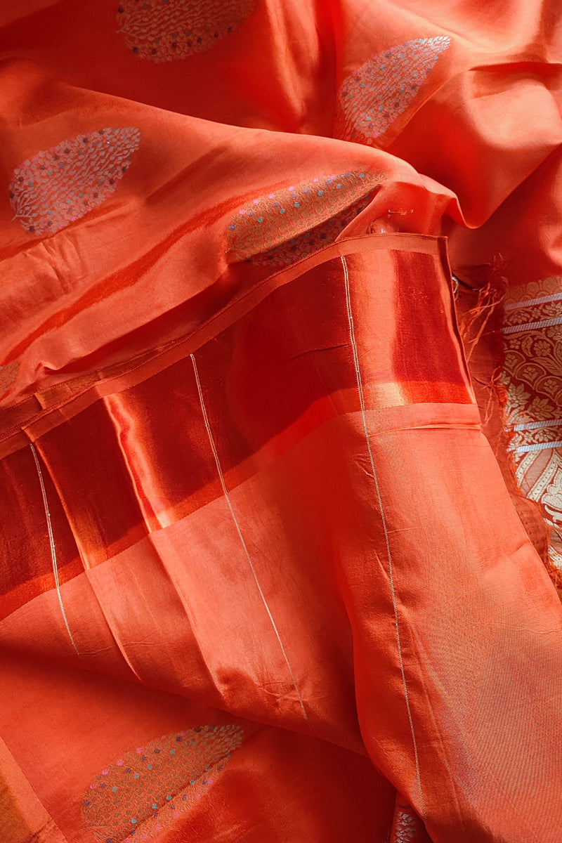 Coral Orange Crepe Silk Saree with Silver-Toned Woven Motifs