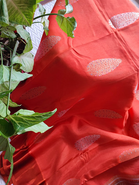 Coral Orange Crepe Silk Saree with Silver-Toned Woven Motifs