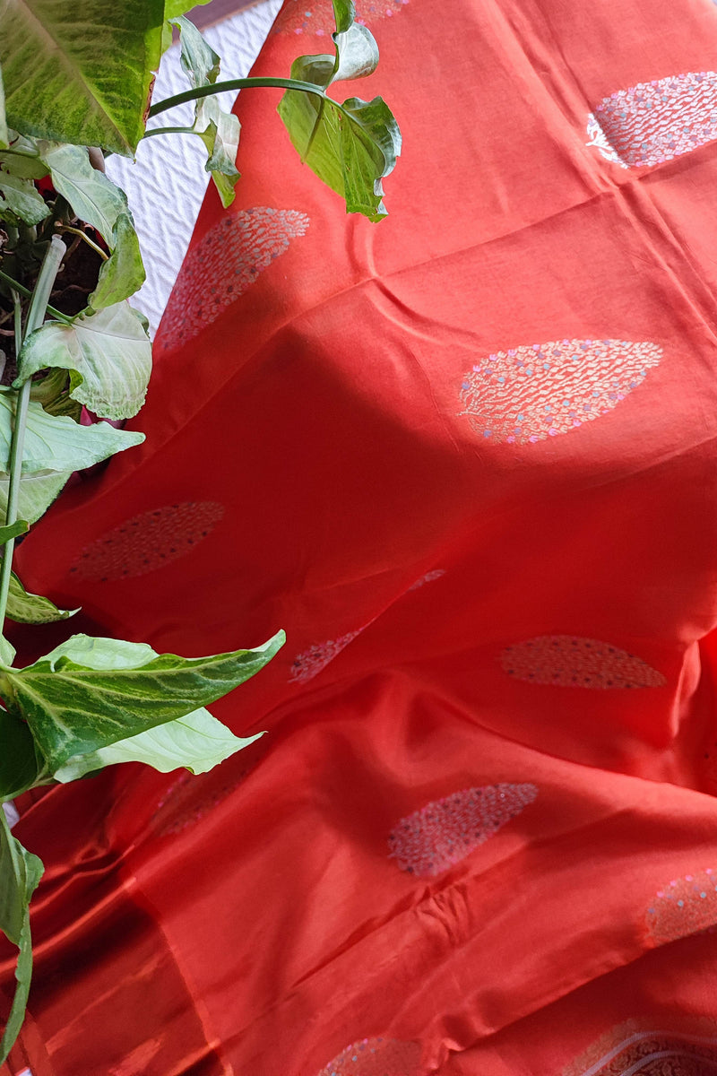 Coral Orange Crepe Silk Saree with Silver-Toned Woven Motifs
