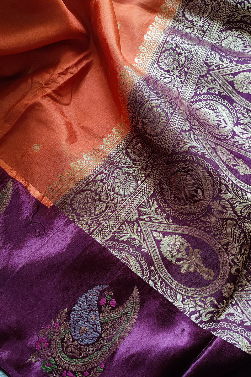 Orange Crepe Silk Saree with Purple Brocade Border & Golden Buti Motifs