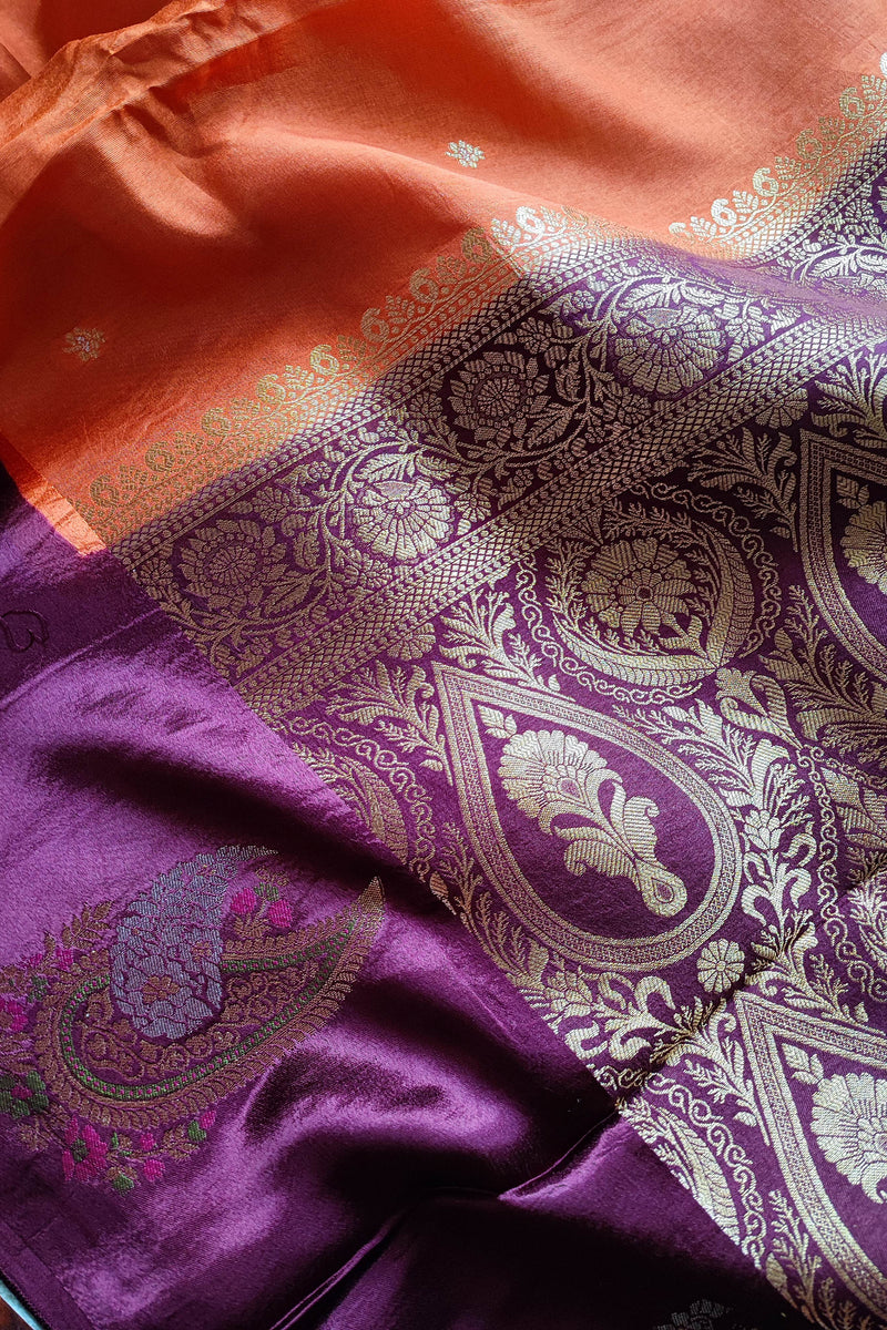 Orange Crepe Silk Saree with Purple Brocade Border & Golden Buti Motifs