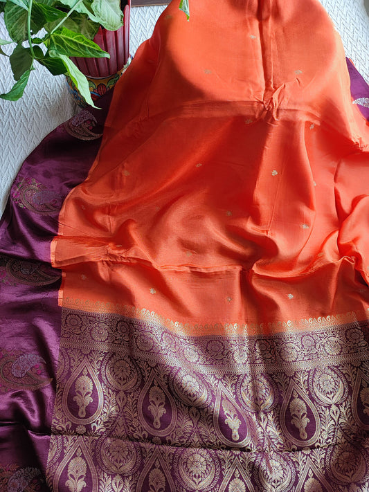 Orange Crepe Silk Saree with Purple Brocade Border & Golden Buti Motifs