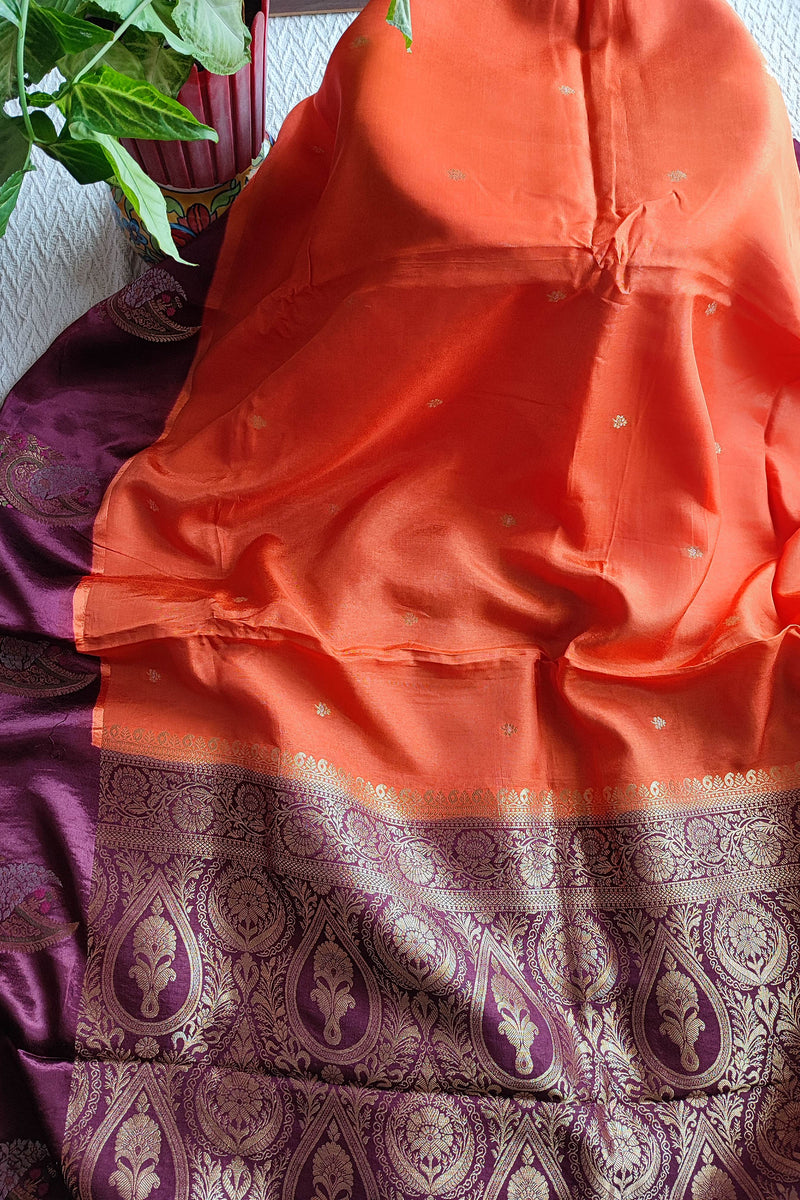 Orange Crepe Silk Saree with Purple Brocade Border & Golden Buti Motifs