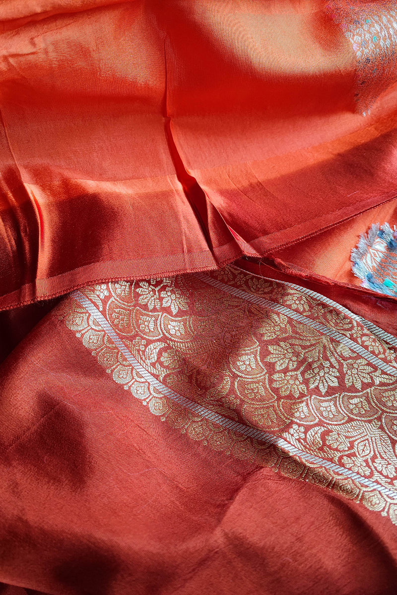Peach Orange Crepe Silk Saree with Golden Motifs & Rich Brocade Border