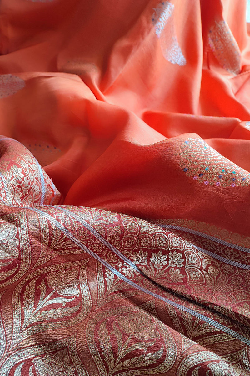 Peach Orange Crepe Silk Saree with Golden Motifs & Rich Brocade Border