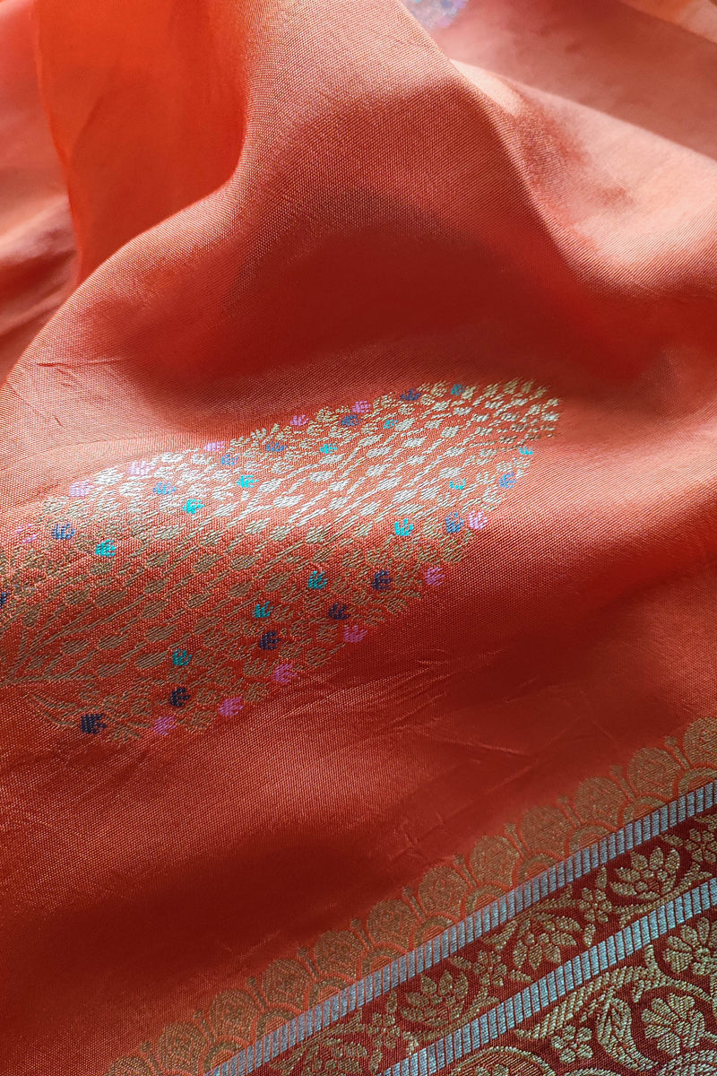 Peach Orange Crepe Silk Saree with Golden Motifs & Rich Brocade Border