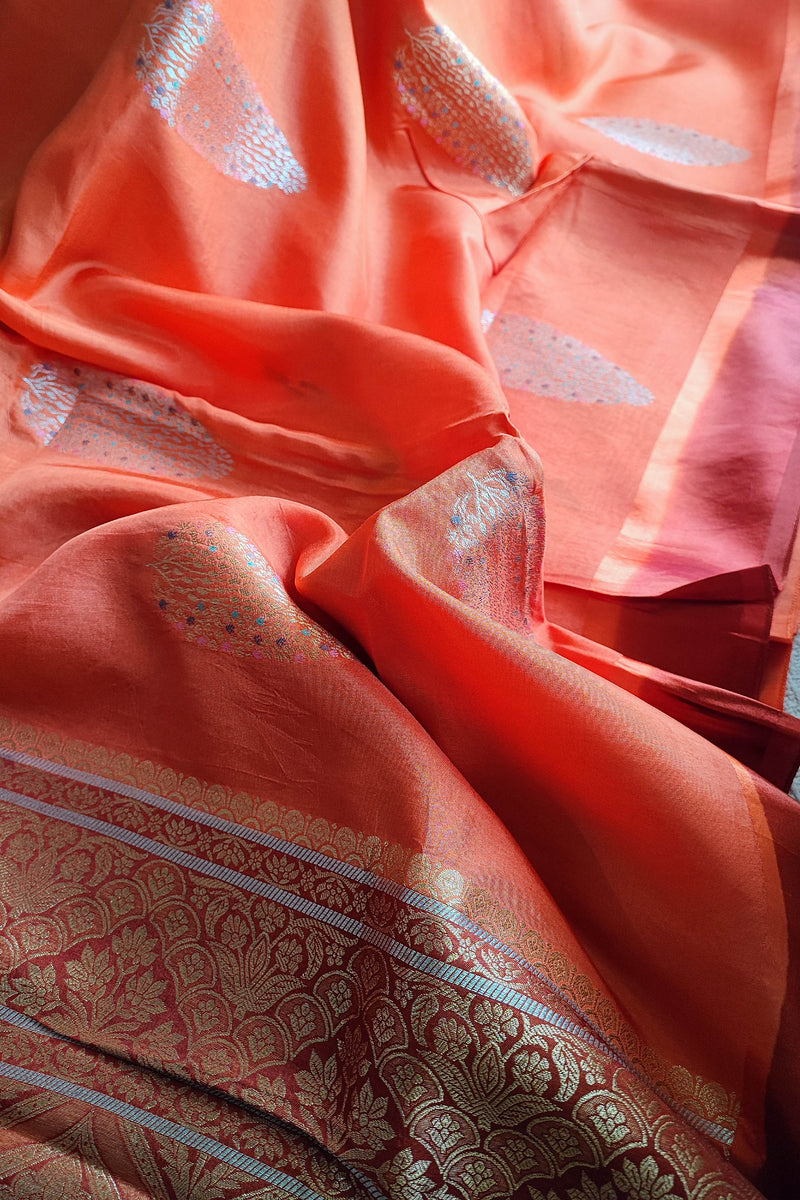 Peach Orange Crepe Silk Saree with Golden Motifs & Rich Brocade Border