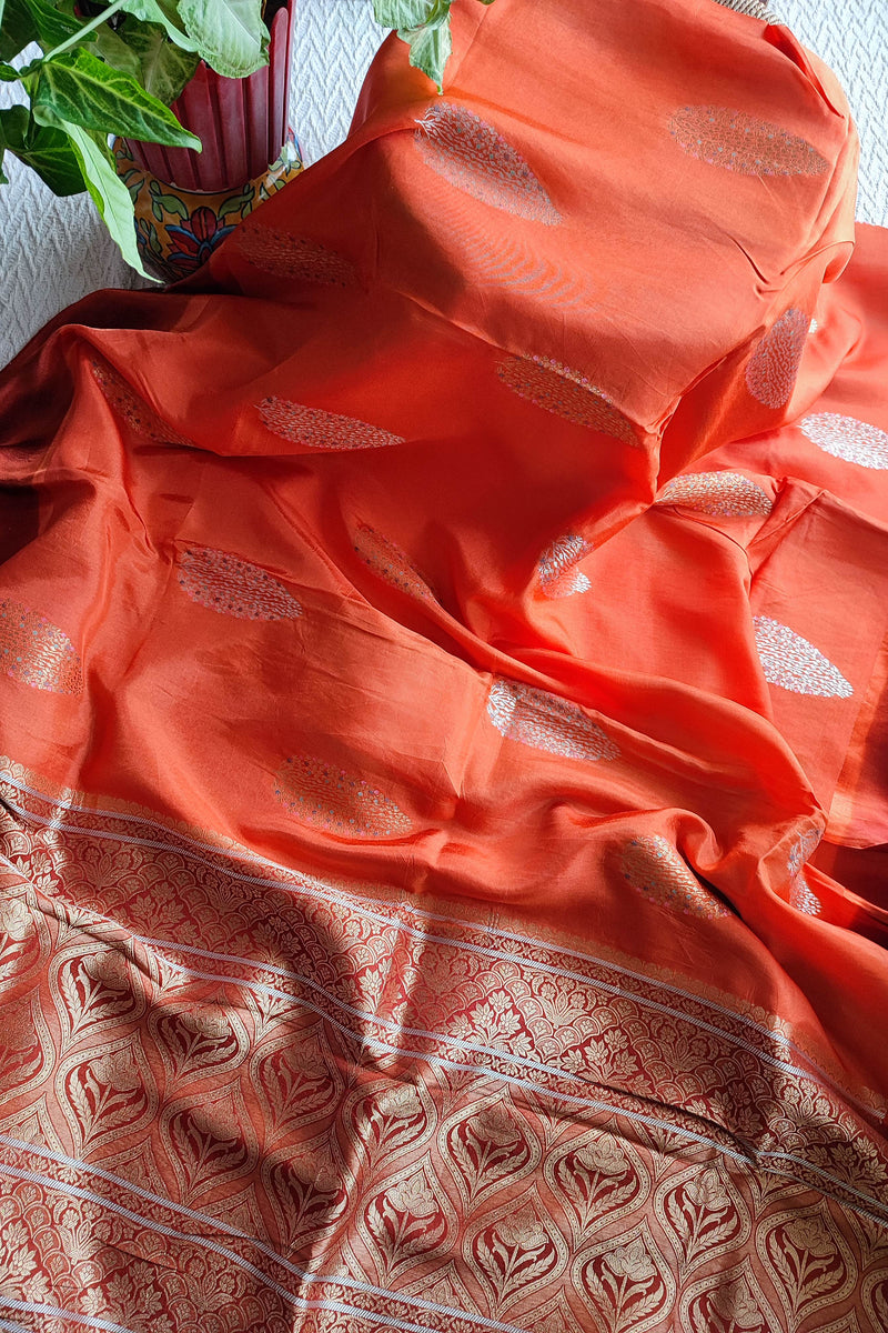 Peach Orange Crepe Silk Saree with Golden Motifs & Rich Brocade Border