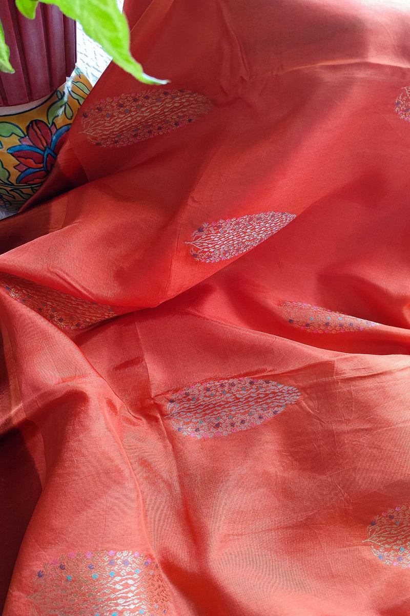 Peach Orange Crepe Silk Saree with Golden Motifs & Rich Brocade Border