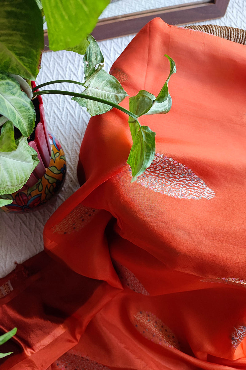 Peach Orange Crepe Silk Saree with Golden Motifs & Rich Brocade Border