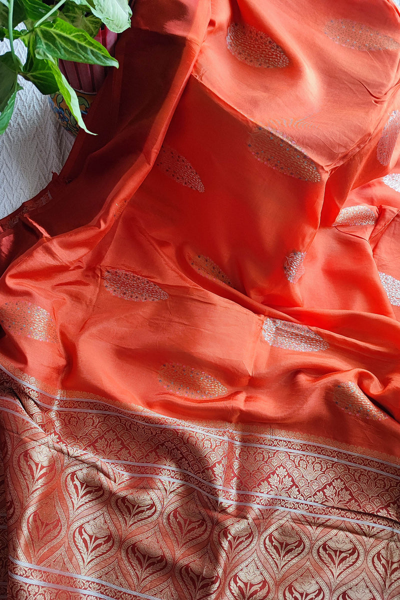 Peach Orange Crepe Silk Saree with Golden Motifs & Rich Brocade Border
